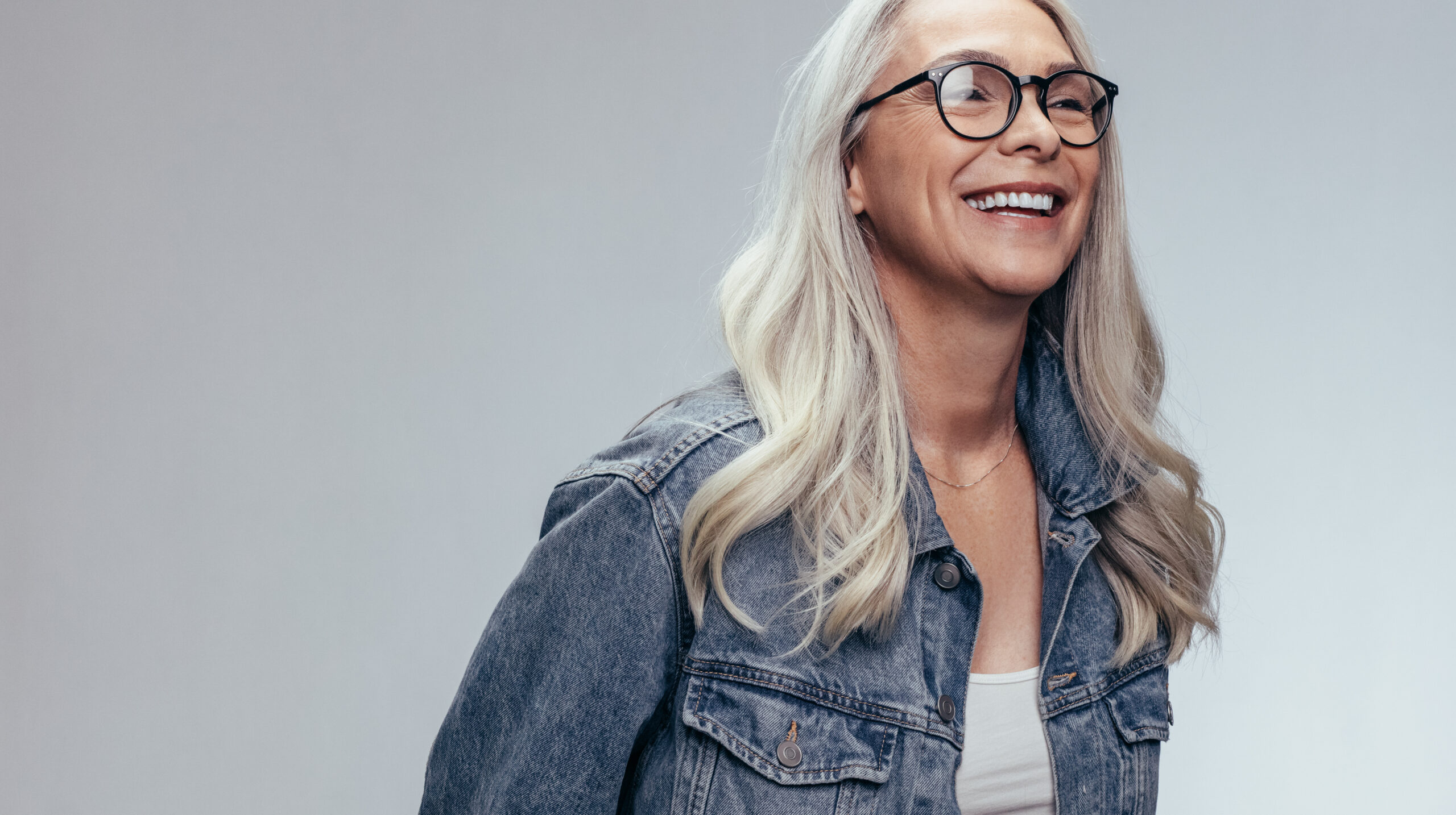Cheerful senior woman in studio